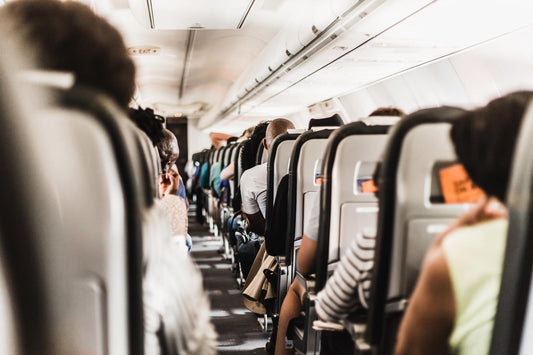 airplane cabin with people sitting