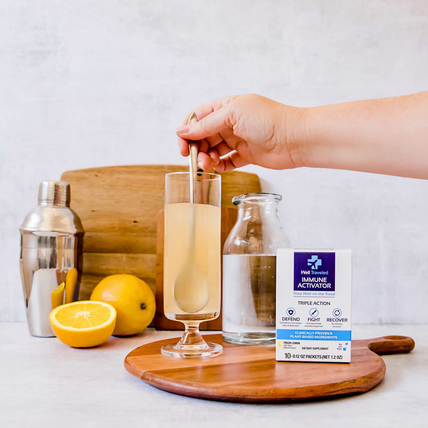 well traveled packet being stirred in glass of water next to box