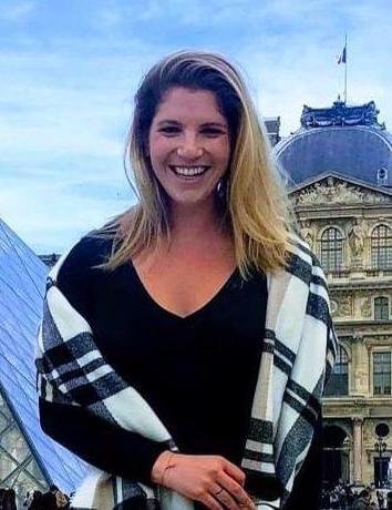 female traveler smiling in Paris
