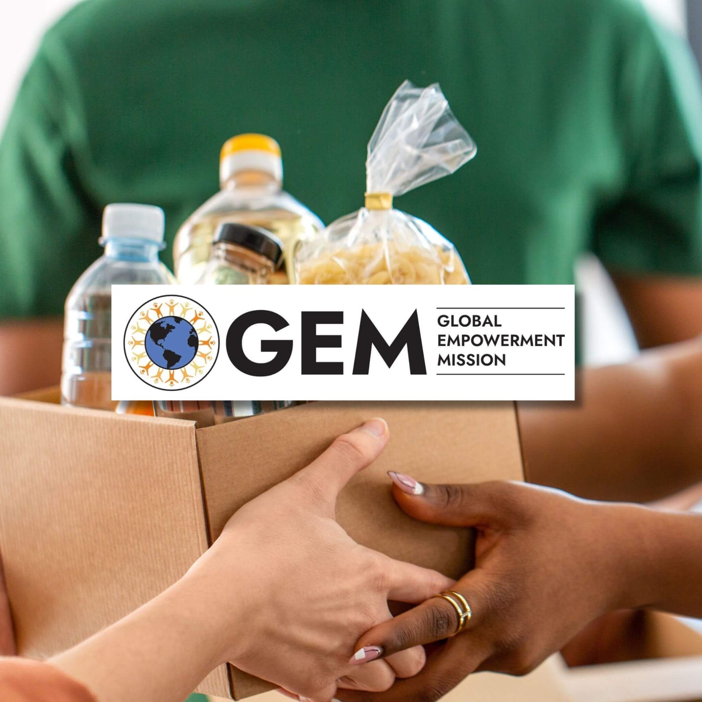global empowerment mission person handing relief box to another person